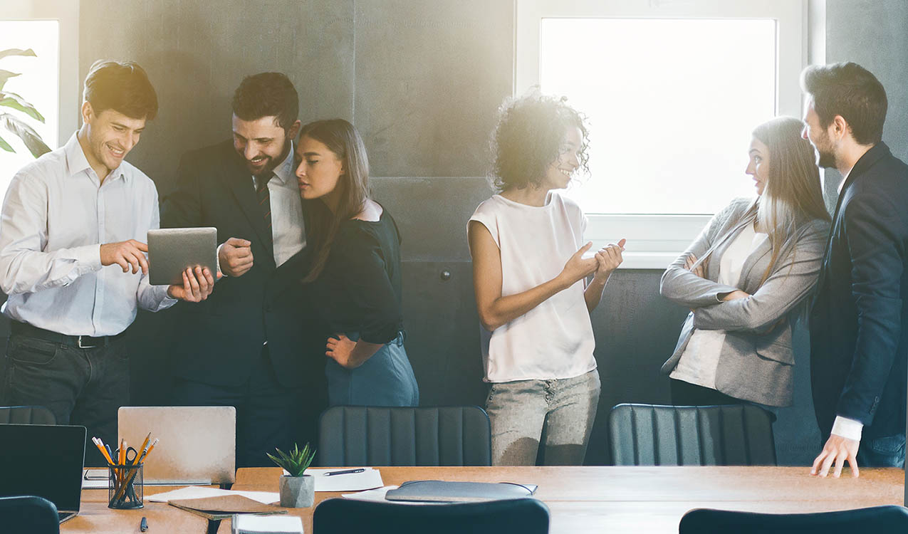 Business people discussing strategies during break in office