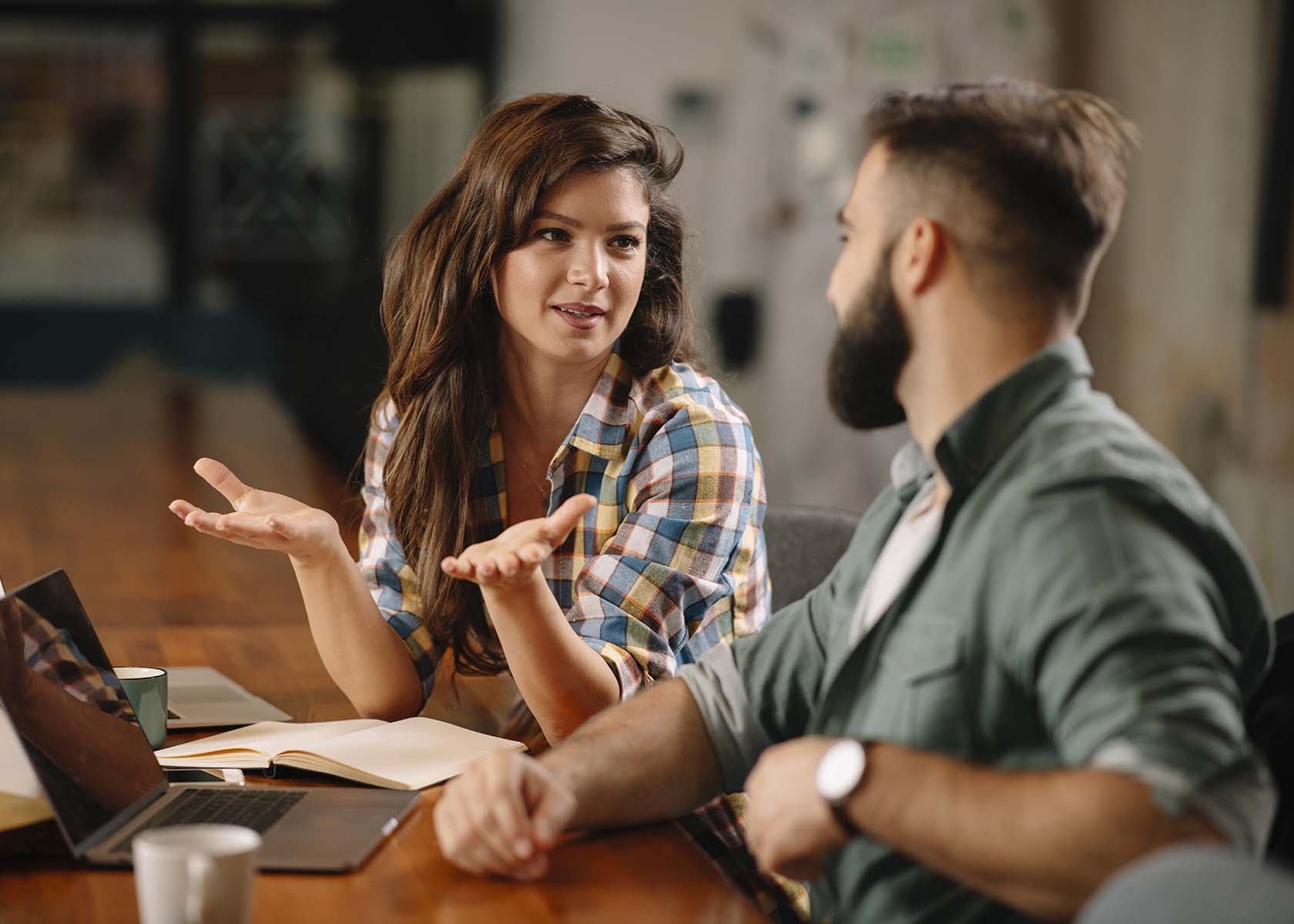 Colleagues in office. Businesswoman and businessman discussing w